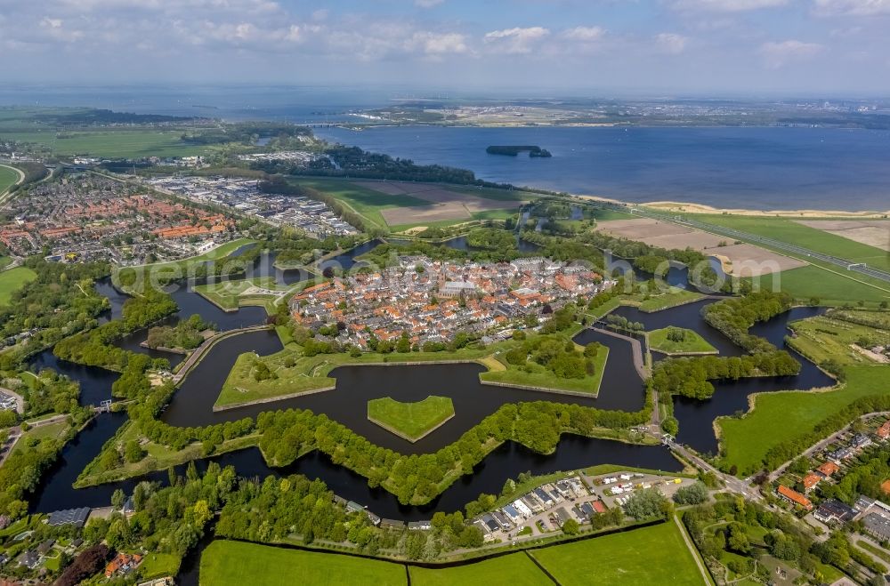 Naarden from the bird's eye view: View the historic center of the fortified town of Naarden in North Holland. Clearly visible is the water channels of the Citadel Wing-scale defenses