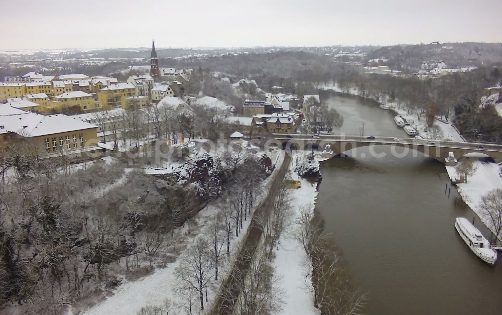 Halle (Saale) from above - Winter with snow covered area on the course of the river Saale at the Krollwitz bridge in Halle (Saale) in Saxony-Anhalt. Also pictured castle Giebichstein and the health center Medikum Halle