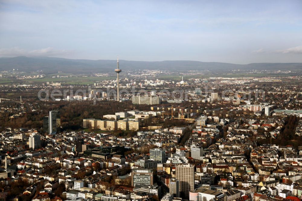 Frankfurt am Main from above - Blick über die Stadt Frankfurt am Main, mit dem Fernsehturm im Zentrum. Der Europaturm wurde 1979 als Fernmeldeturm in Betrieb genommen und wird heute von der Deutschen Telekom genutzt. View to the city of Frankfurt on the Main, with the television tower in the center.