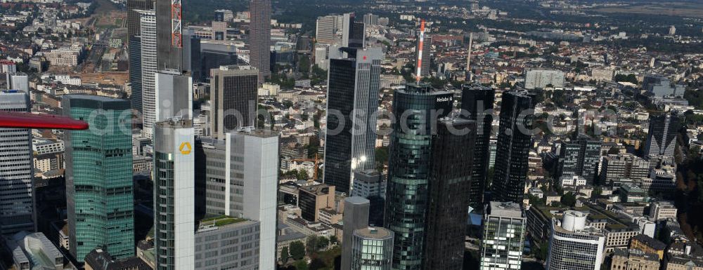 Frankfurt am Main from above - Blick auf die Frankfurter Skyline am Main. Das Frankfurter Banken-, und Bürohauszentrum reiht die Mainmetropole in die Liste typische europäischer Hochhausstädte ein. View of the Frankfurt am Main skyline. The Frankfurt banking, and office center joins a list of the main metropolis in the typical high-rise European citys.