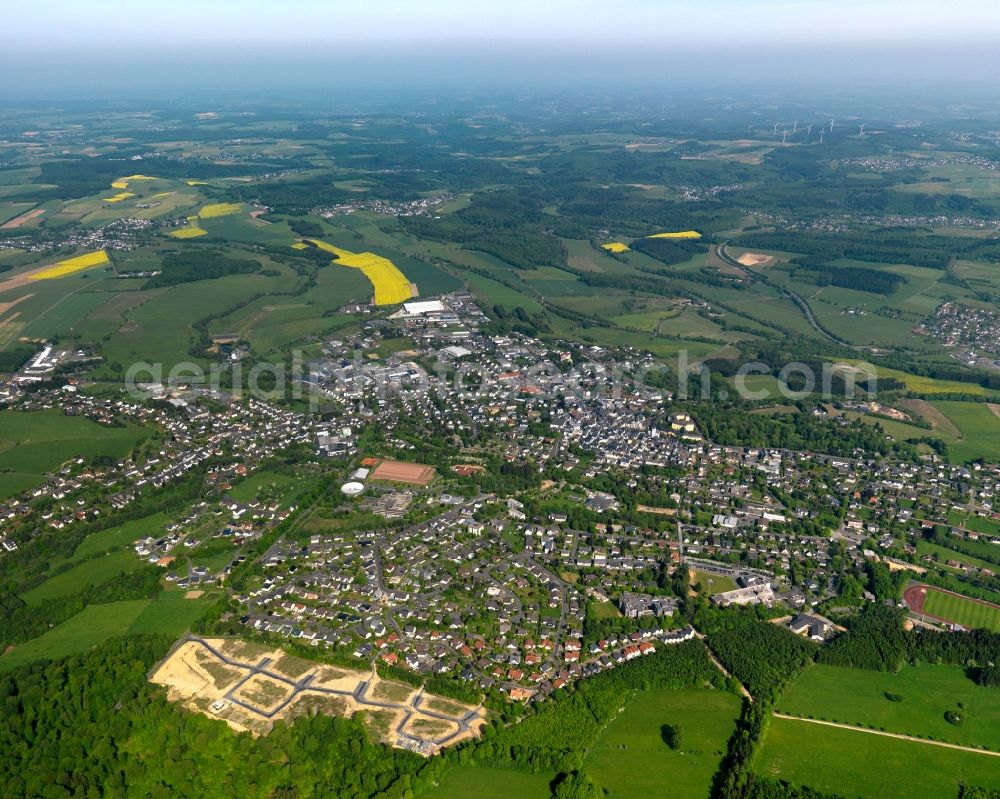 Aerial image Hachenburg - View of the town of Hachenburg in the state of Rhineland-Palatinate. The town is an official spa resort in the Westerwald region and county district. It is surrounded by agricultural fields and meadows