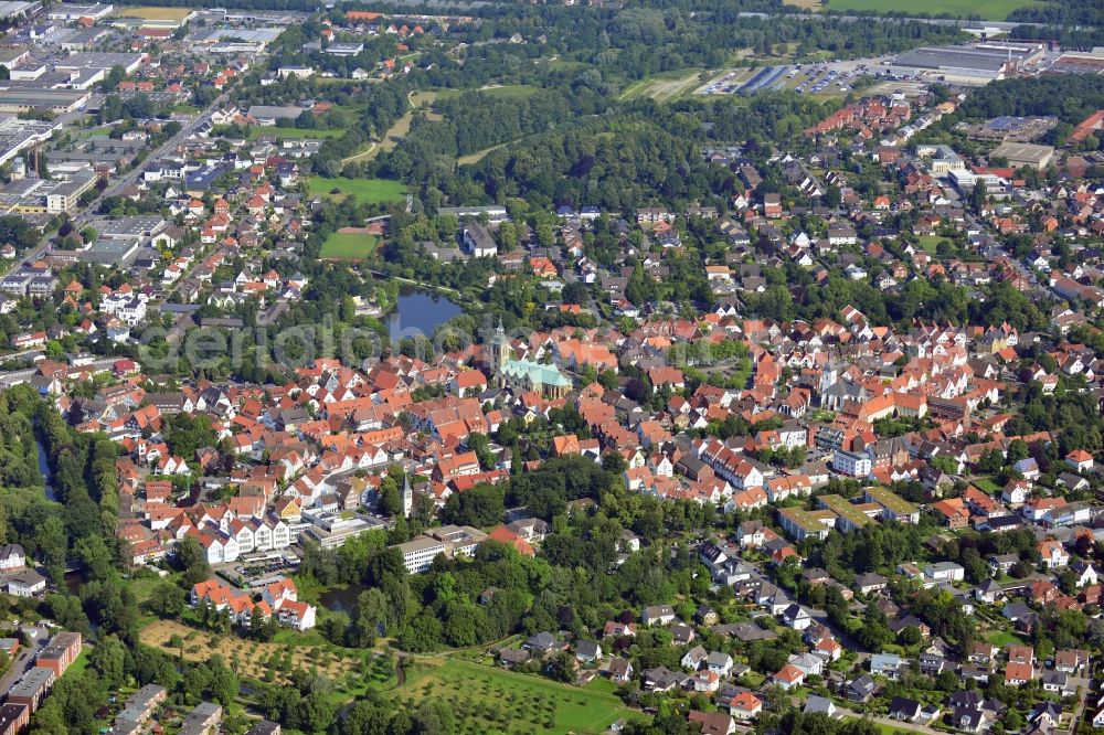 Rheda-Wiedenbrück from above - View of the cityscape of the city center of the Wiedenbrück part of the double city of Rheda - Wiedenbrück in the state of North Rhine-Westphalia. View of the historic centre, the lake Emssee and the St.Aegidius Church. The church exists at its current location for more than 1000 years. It was built in Romanic and Gothic style and is characterised by the tower and the main building that consists of three naves