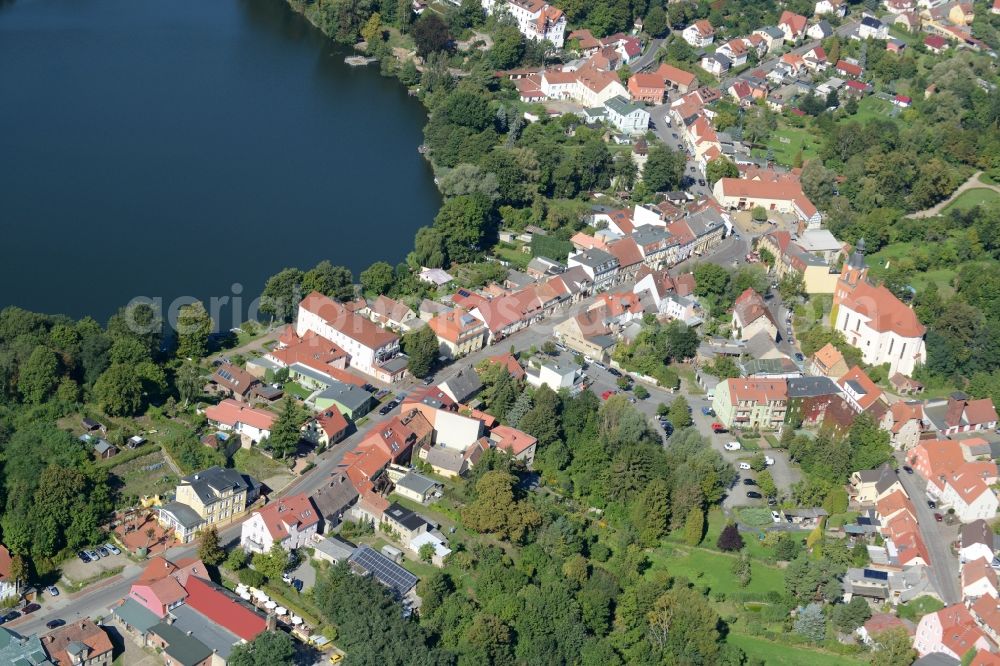 Buckow (Märkische Schweiz) from above - View of the town centre of Buckow (Maerkische Schweiz) in the state of Brandenburg. The town centre with its historic buildings and churches is located on lake Buckowsee