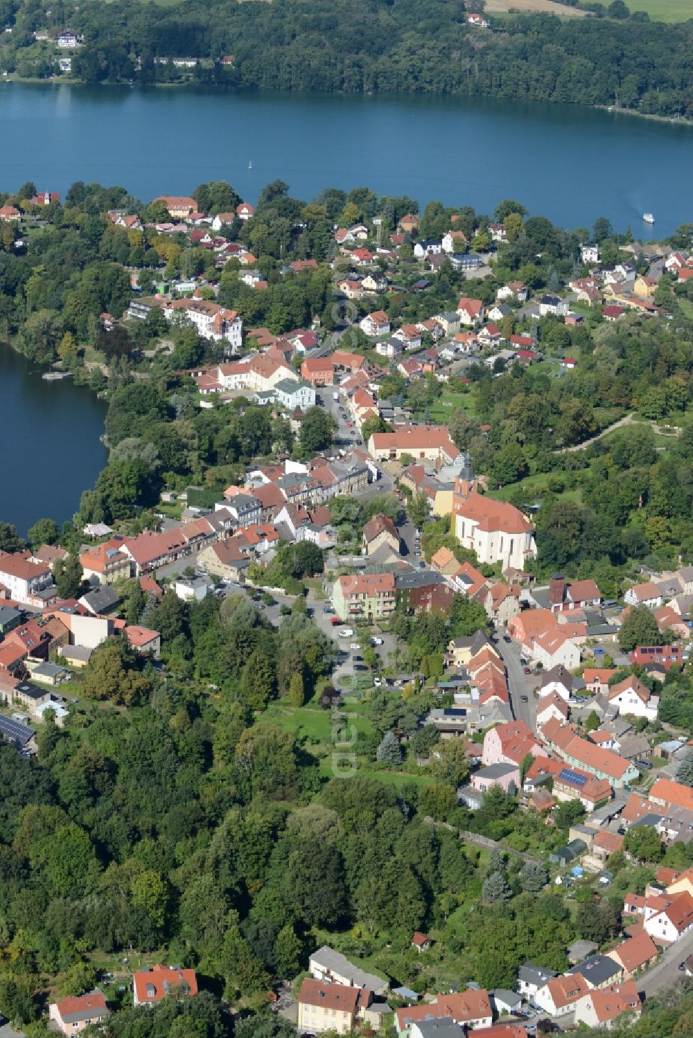 Buckow (Märkische Schweiz) from the bird's eye view: View of the town centre of Buckow (Maerkische Schweiz) in the state of Brandenburg. The town centre with its historic buildings and churches is located on lake Buckowsee