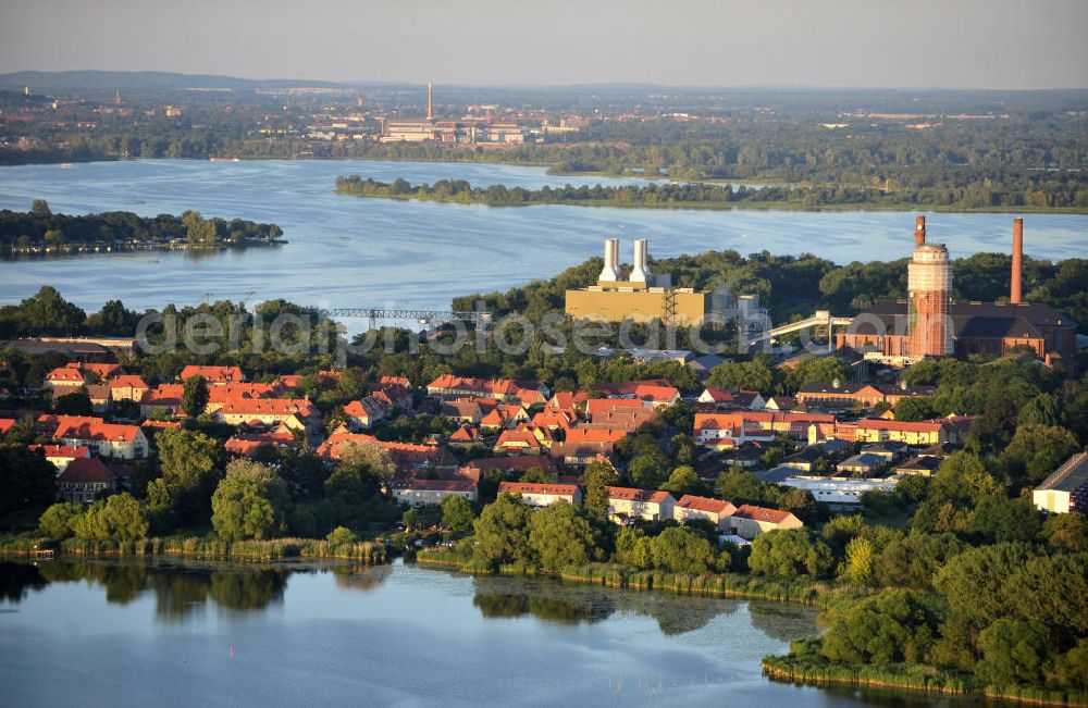 Brandenburg - Kirchmöser from the bird's eye view: Stadtansicht des Stadteils Kirchmöser, Brandenburg an der Havel. Hinter den Wohngebieten am Uferbereich das von e.on betriebene Gaskraftwerk mit dem weithin sichtbaren Wasserturm. Die Halbinsel liegt im Plauer See. Cityscape of Brandenburg Kirchmoeser. On the picture the gas power station by e.on that produces energy for the and the water tower, which reminds of the former gunpowder factory. The peninsula is located in the Plauer lake.