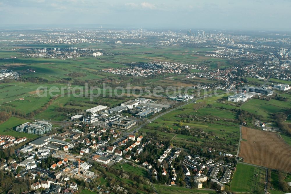 Kronberg im Taunus from above - View of the city of Kronberg im Taunus in the state of Hesse. Kronberg is a beloved and offical spa town on the foothills of the Taunus region. With its industrial area in its South, it is home to several international companies such as Braun, Accenture or Fidelity. View from the North to the South East