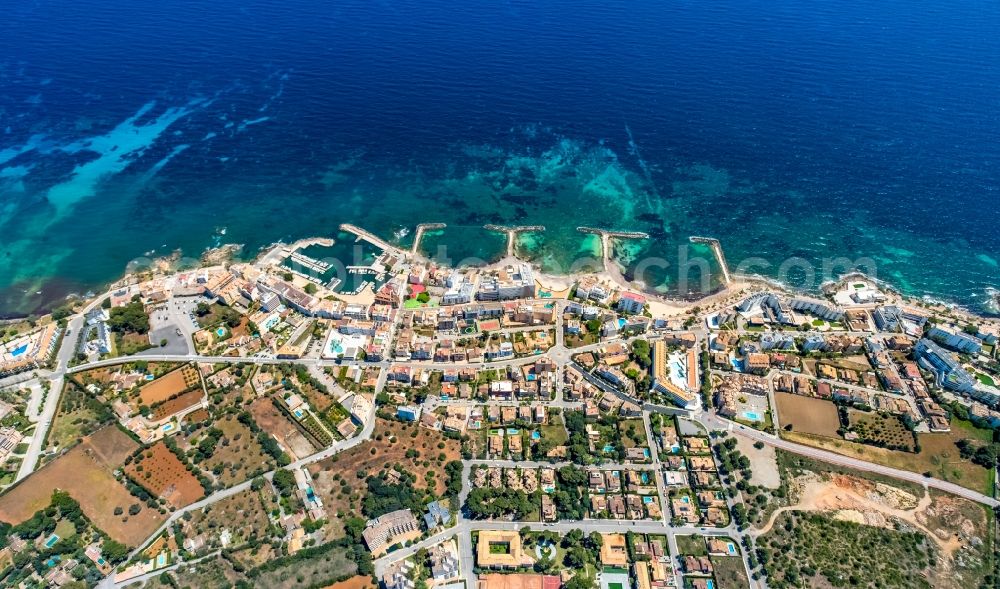 Aerial image Cala Bona - City view on sea coastline with the local port facilities in Cala Bona in Balearic island of Mallorca, Spain