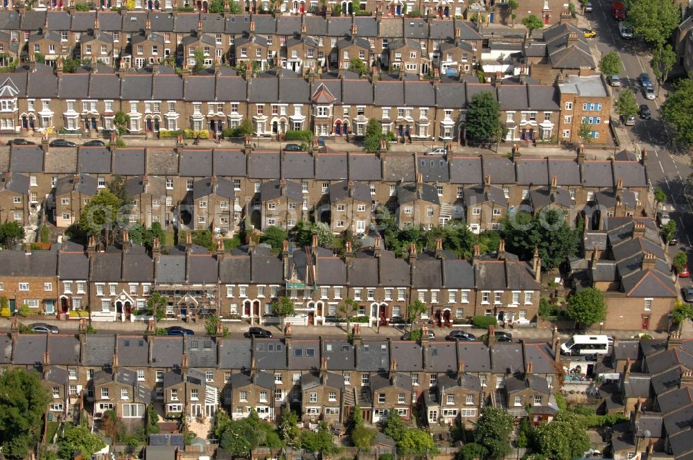 Aerial photograph London - LONDON 20/06/2012 by the London cityscape row-house residential neighborhood in Stonebridge. The typical British house's series settlements emerged in the 70s