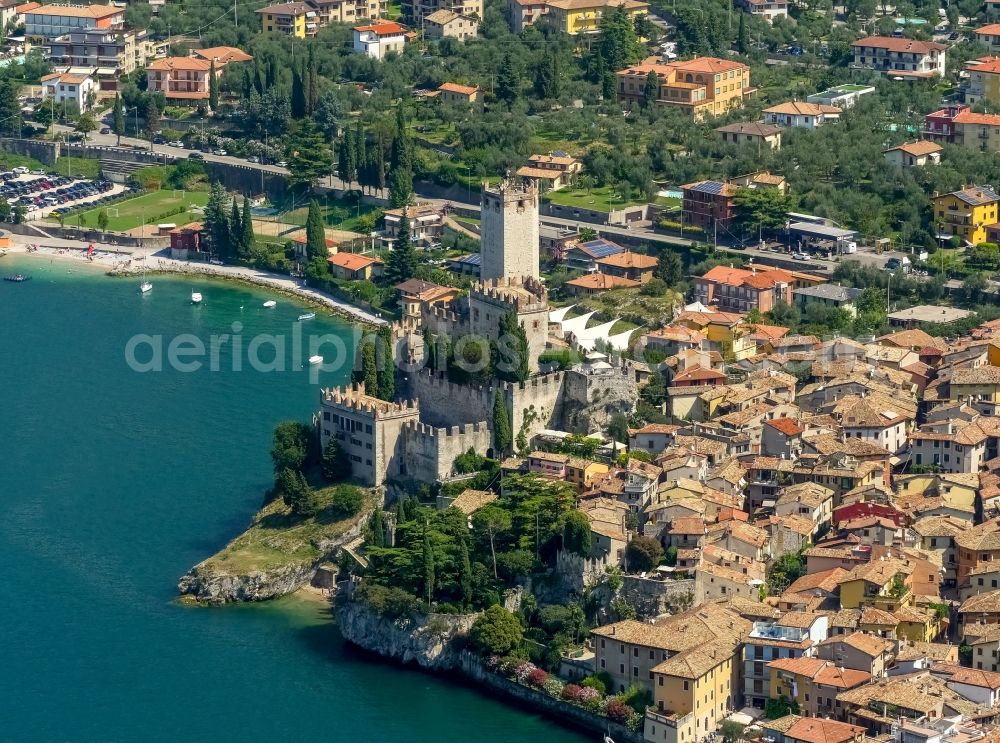 Malcesine from above - City view of Malcesine with the castle Castello di Malcesine at the Garda sea in Veneto, Italy