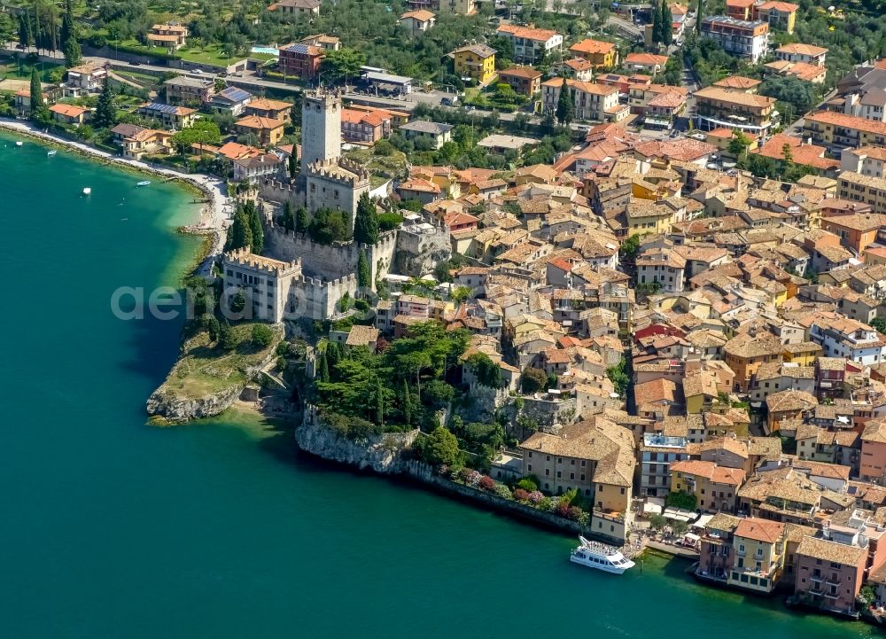 Aerial image Malcesine - City view of Malcesine with the castle Castello di Malcesine at the Garda sea in Veneto, Italy