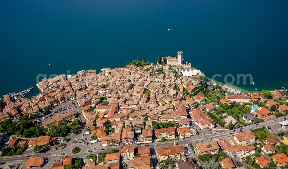 Malcesine from the bird's eye view: City view of Malcesine with the castle Castello di Malcesine at the Garda sea in Veneto, Italy