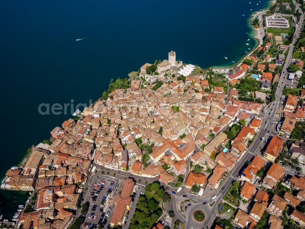 Aerial image Malcesine - City view of Malcesine with the castle Castello di Malcesine at the Garda sea in Veneto, Italy