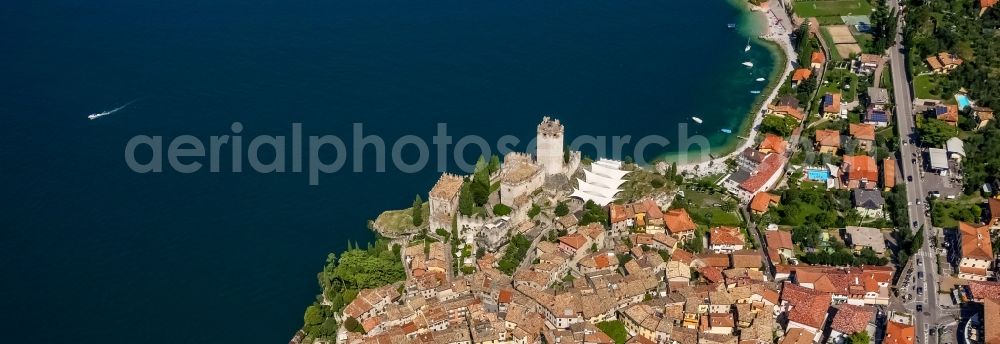 Malcesine from above - City view of Malcesine with the castle Castello di Malcesine at the Garda sea in Veneto, Italy