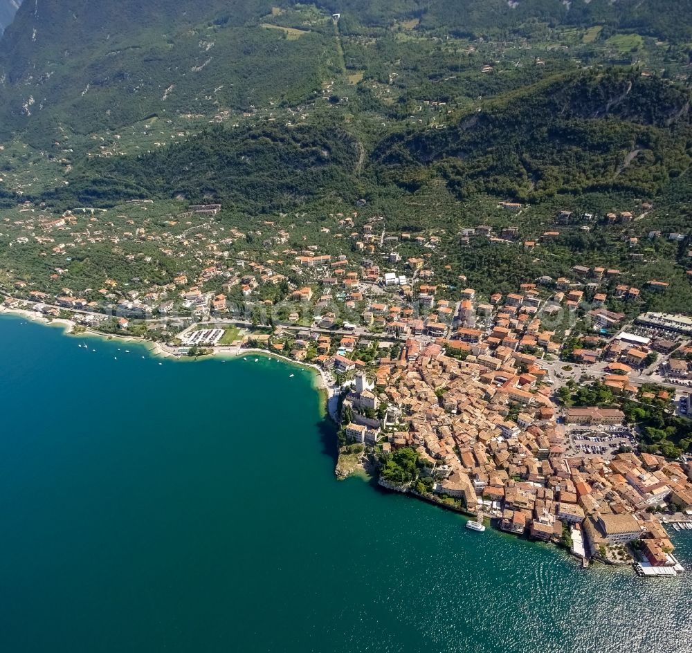 Malcesine from the bird's eye view: City view of Malcesine with the castle Castello di Malcesine at the Garda sea in Veneto, Italy