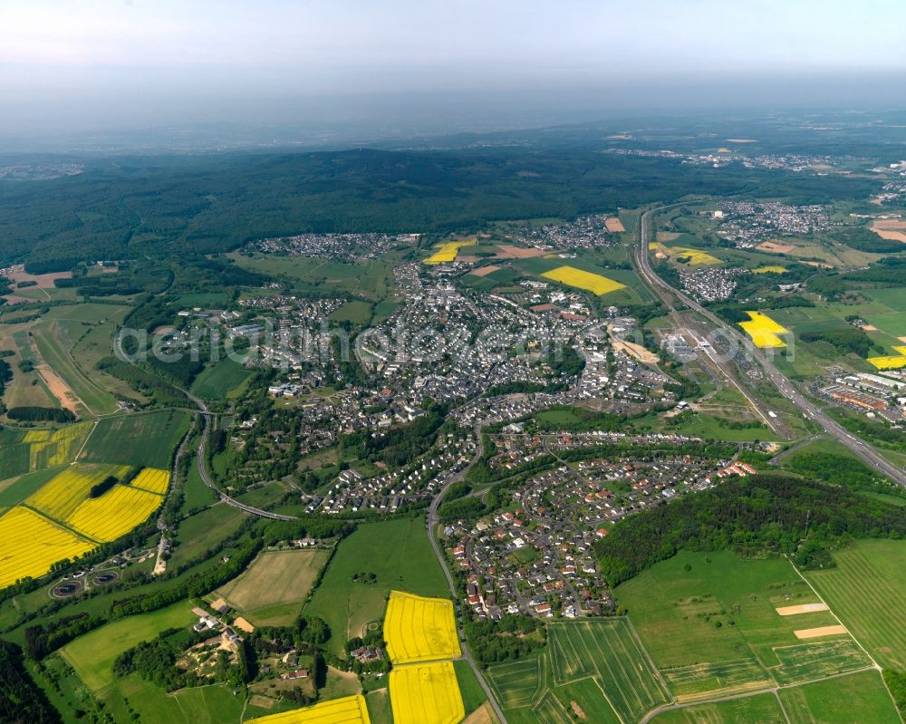 Montabaur from above - View of the town of Montabaur in the state Rhineland-Palatinate. The official tourist resort is the seat of administration of the county district of Westerwald. The town is an economic centre of the region and know for its castle and train station. The federal motorway A8 takes its course in the North of the town