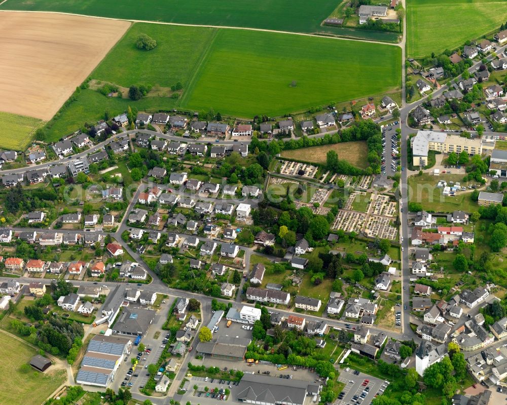 Aerial image Nastätten - View of the town of Nastaetten in the state of Rhineland-Palatinate. The official tourist resort is located in the county district of Rhine-Lahn, in the Western Hintertaunus mountain region and is the centre of the so-called Blue Country. The town consists of residential areas, is located on federal highway B274 and is surrounded by rapeseed fields and meadows