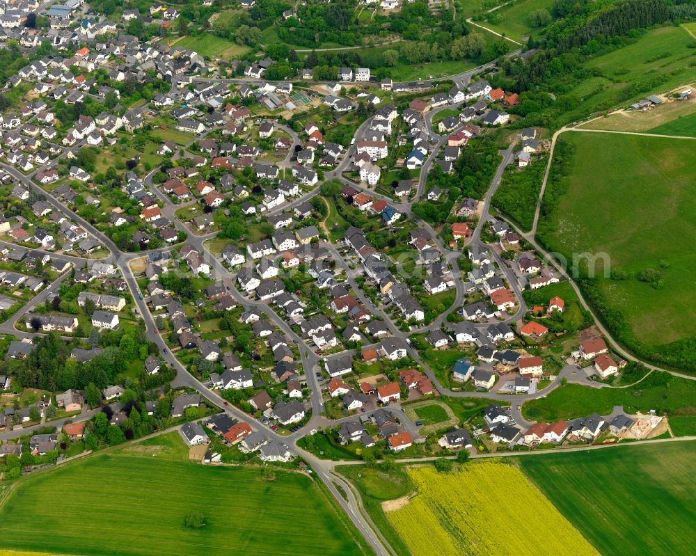 Aerial image Nastätten - View of the town of Nastaetten in the state of Rhineland-Palatinate. The official tourist resort is located in the county district of Rhine-Lahn, in the Western Hintertaunus mountain region and is the centre of the so-called Blue Country. The town consists of residential areas, is located on federal highway B274 and is surrounded by rapeseed fields and meadows