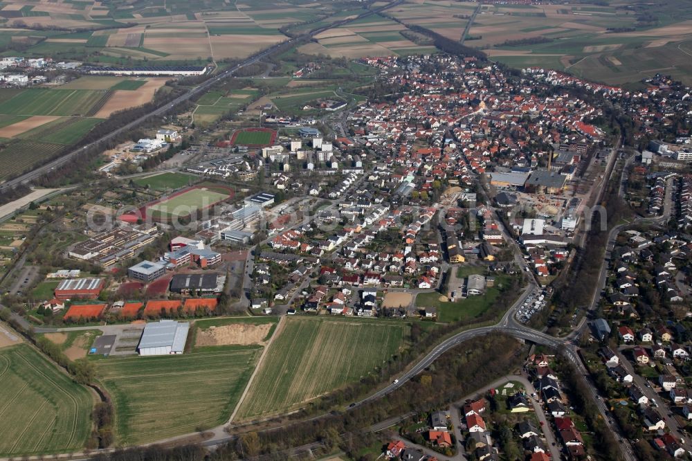 Aerial photograph Nieder-Olm - View of Nieder-Olm in the state Rhineland-Palatinate. The town is located in the county district of Mainz-Bingen, in the region of Mainzer Becken. The urban area consists of wooded residential areas and single family houses and is surrounded by fields. Nieder-Olm is located adjacent to the federal motorway A63 and includes a wide industrial area in the West of the town