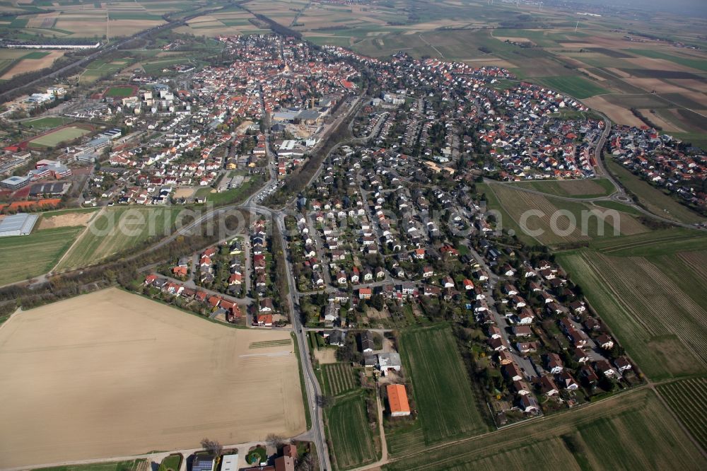 Nieder-Olm from above - View of Nieder-Olm in the state Rhineland-Palatinate. The town is located in the county district of Mainz-Bingen, in the region of Mainzer Becken. The urban area consists of wooded residential areas and single family houses and is surrounded by fields. Nieder-Olm is located adjacent to the federal motorway A63 and includes a wide industrial area in the West of the town