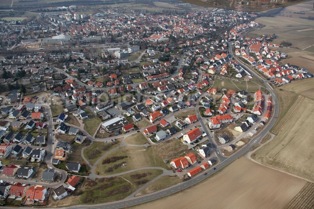 Aerial image Nieder-Olm - View of Nieder-Olm in the state Rhineland-Palatinate. The town is located in the county district of Mainz-Bingen, in the region of Mainzer Becken. The urban area consists of wooded residential areas and single family houses and is surrounded by fields. Nieder-Olm is located adjacent to the federal motorway A63 and includes a wide industrial area in the West of the town