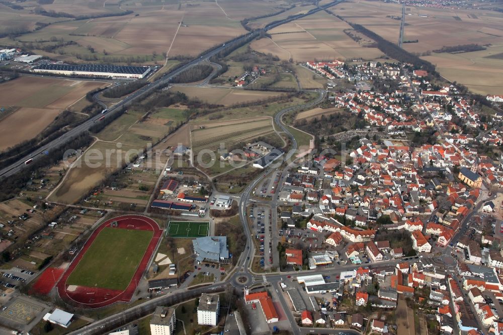 Nieder-Olm from above - View of Nieder-Olm in the state Rhineland-Palatinate. The town is located in the county district of Mainz-Bingen, in the region of Mainzer Becken. The urban area consists of wooded residential areas and single family houses and is surrounded by fields. Nieder-Olm is located adjacent to the federal motorway A63 and includes a wide industrial area in the West of the town