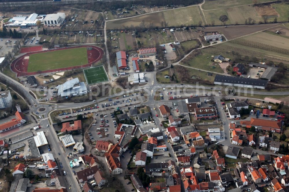 Aerial image Nieder-Olm - View of Nieder-Olm in the state Rhineland-Palatinate. The town is located in the county district of Mainz-Bingen, in the region of Mainzer Becken. The urban area consists of wooded residential areas and single family houses and is surrounded by fields. Nieder-Olm is located adjacent to the federal motorway A63 and includes a wide industrial area in the West of the town