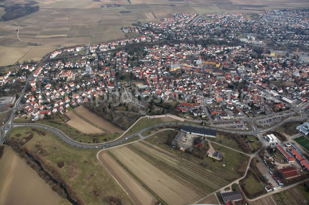 Nieder-Olm from above - View of Nieder-Olm in the state Rhineland-Palatinate. The town is located in the county district of Mainz-Bingen, in the region of Mainzer Becken. The urban area consists of wooded residential areas and single family houses and is surrounded by fields. Nieder-Olm is located adjacent to the federal motorway A63 and includes a wide industrial area in the West of the town