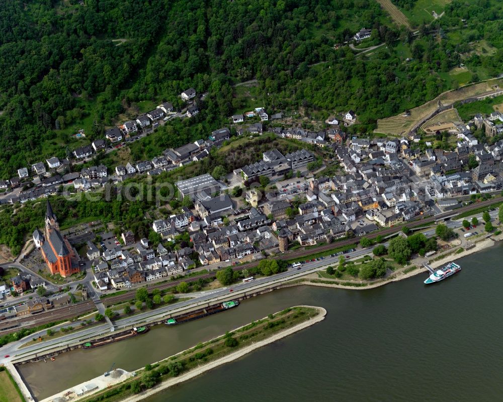 Oberwesel from the bird's eye view: View of the town of Oberwesel in the state of Rhineland-Palatinate. The small town is located in the Rhine-Hunsrueck county district on the left riverbank of the Rhine. It is an official tourist resort sitting on the steep slopes of the riverfront