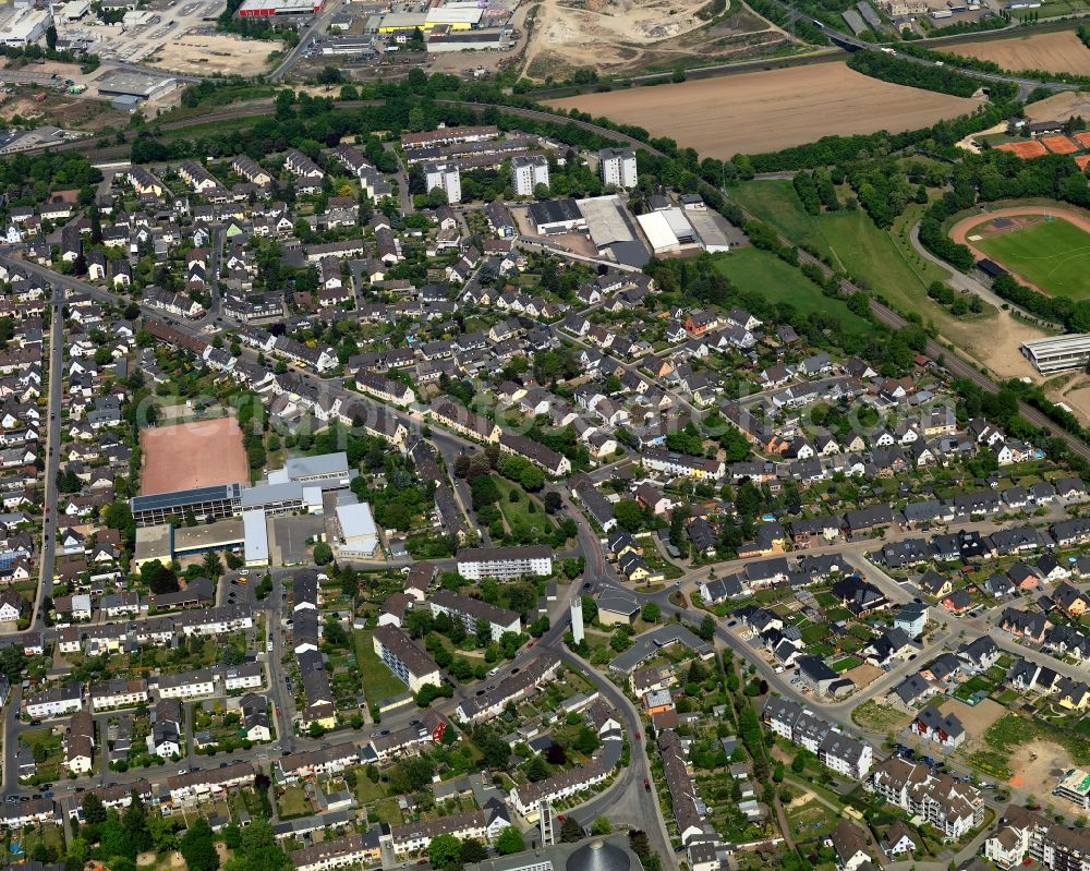 Andernach from above - View of the East of downtown Andernach in the state of Rhineland-Palatinate. The town is located in the county district of Mayen-Koblenz on the left riverbank of the river Rhine. The town is characterised by industry, consists of five boroughs and districts and belongs to the oldest towns in Germany. The east of Andernach is characterised by residential blocks and estates and is home to the grammar and public school St. Stephan with its outdoor sports facilities