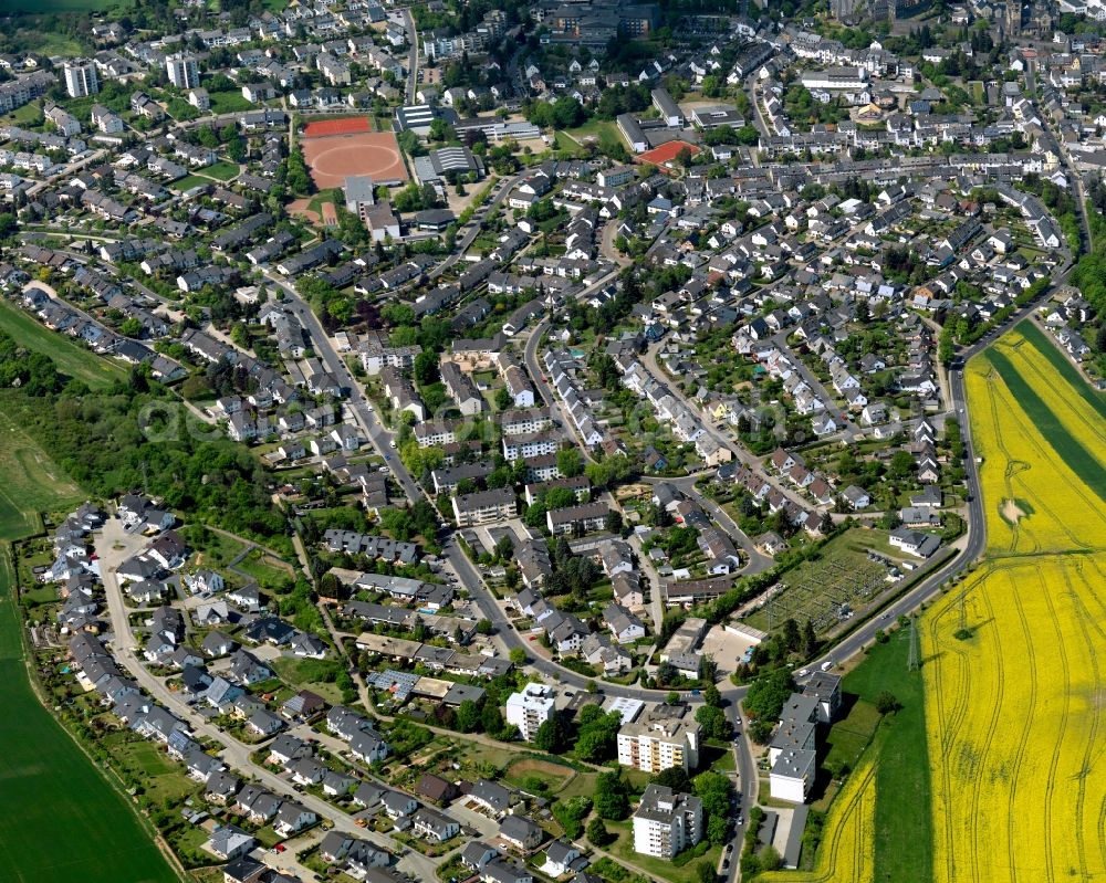 Aerial image Mayen - View of Mayen in the state Rhineland-Palatinate. The town is located in the county district of Mayen-Koblenz in the Eifel region. The urban area is crossed by the river Nette. Mayen consists of a main town and four boroughs and districts. A residential area, surrounded by rapeseed fields, is located in the South of the main town