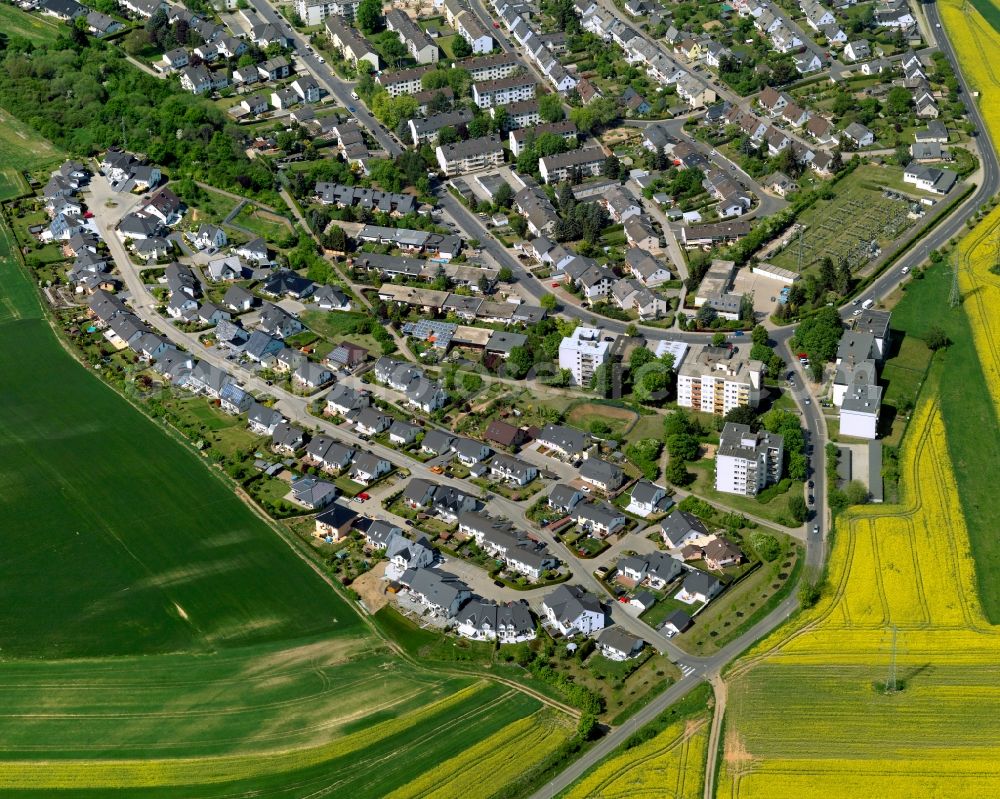 Aerial photograph Mayen - View of Mayen in the state Rhineland-Palatinate. The town is located in the county district of Mayen-Koblenz in the Eifel region. The urban area is crossed by the river Nette. Mayen consists of a main town and four boroughs and districts. A residential area, surrounded by rapeseed fields, is located in the South of the main town