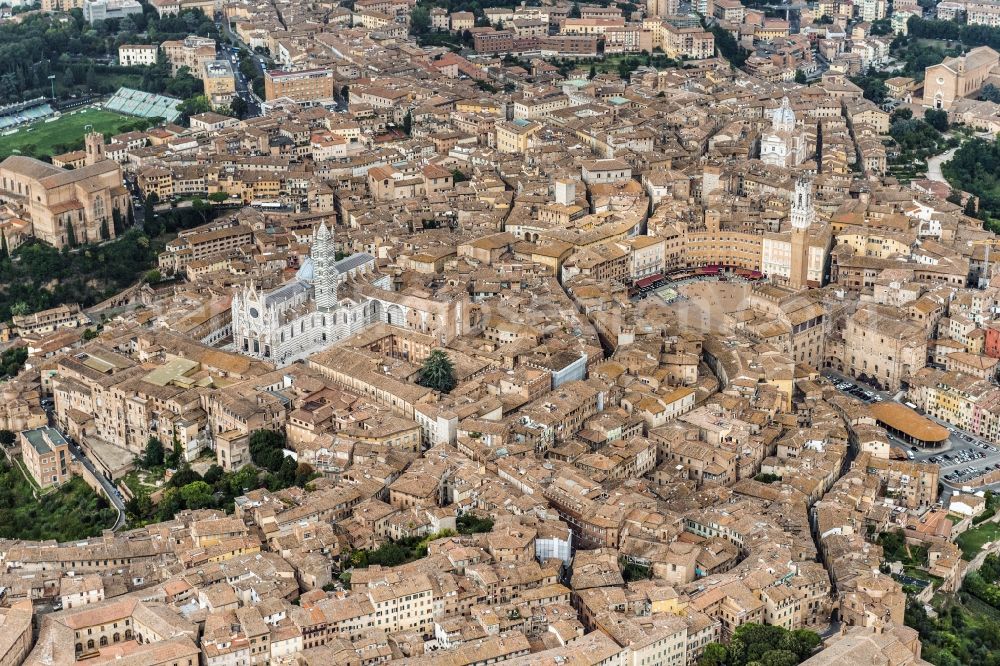 Siena from above - City view of Siena in the homonymous province in Italy. Between various buildings, the Gothic cathedral and the Palazzo Publico is the Torre del Mangia