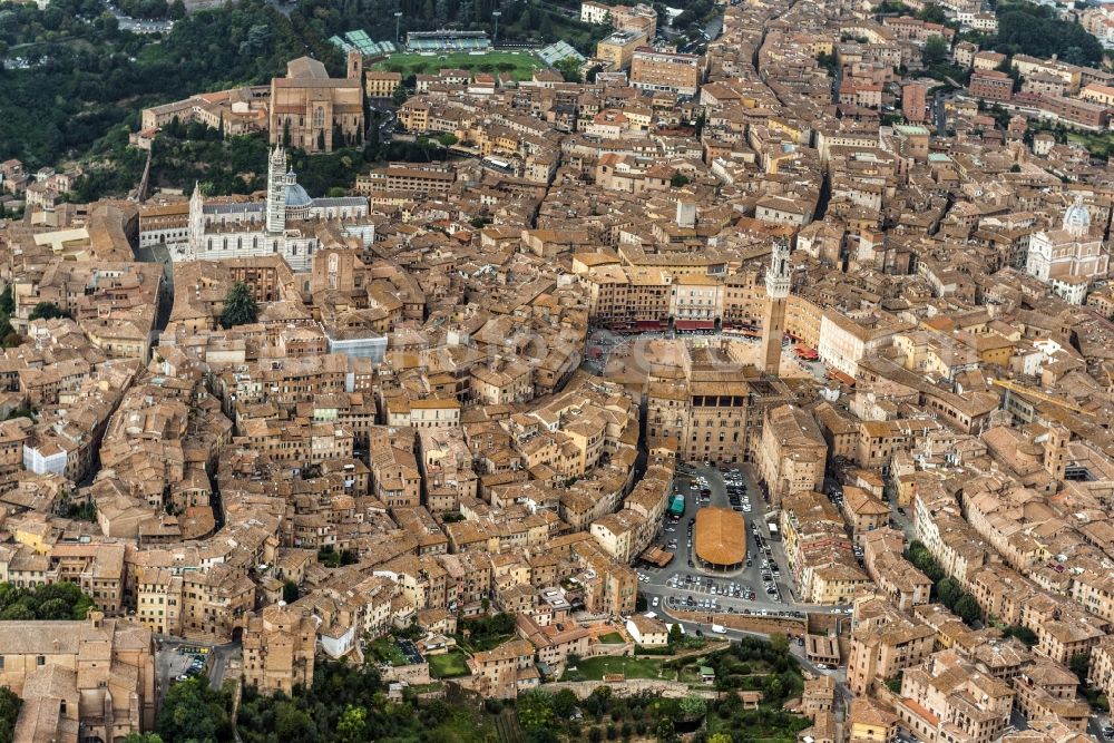 Siena from the bird's eye view: City view of Siena in the homonymous province in Italy. Between various buildings, the Gothic cathedral and the Palazzo Publico is the Torre del Mangia