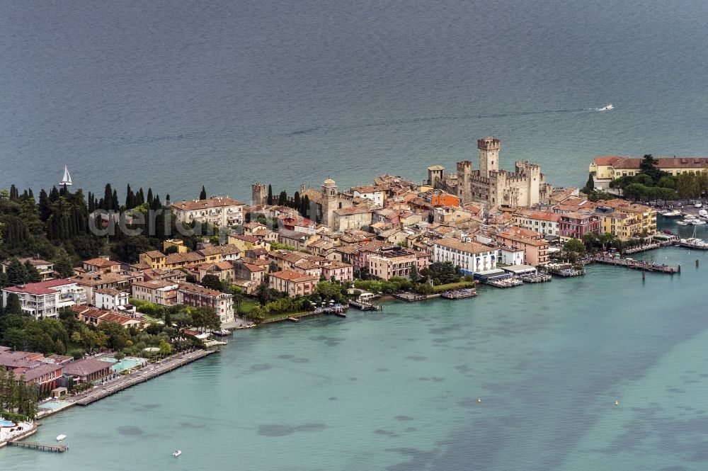 Aerial image Sirmione - City view of Sirmione in the province Brescia in Italy. The city is next to the south bank at the gardasee. In the right corner stands the Sirmione castle