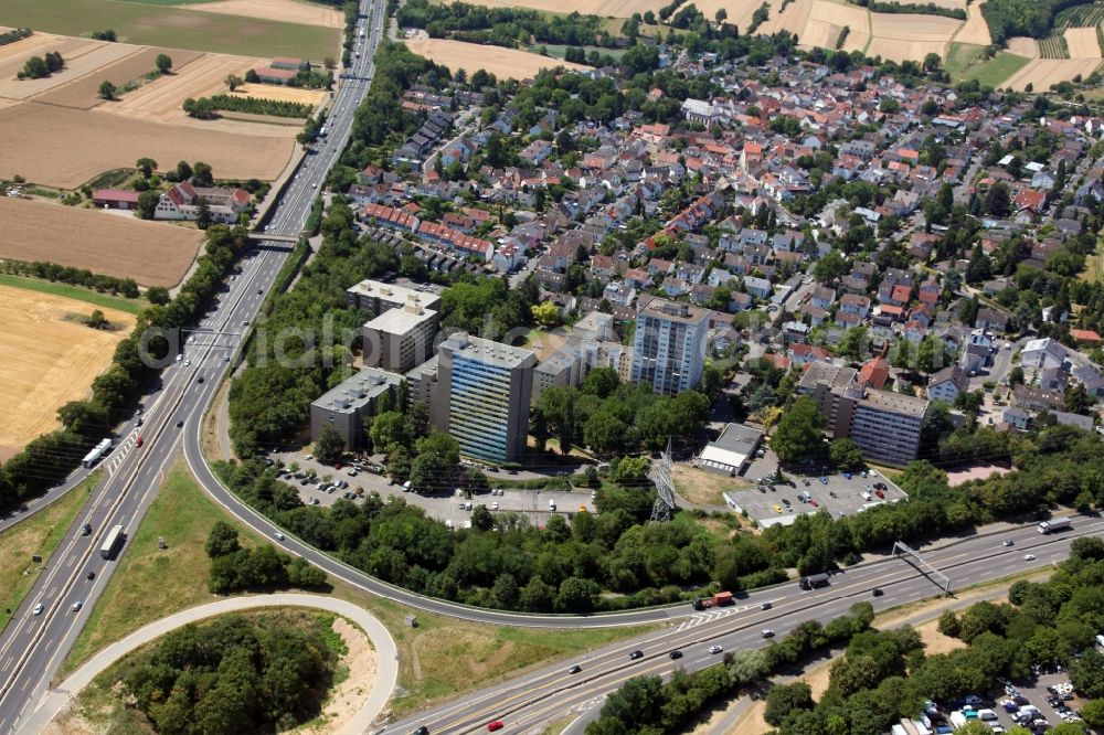 Mainz from the bird's eye view: District in the city in the district Marienborn in Mainz in the state Rhineland-Palatinate, Germany. In the foreground some skyscrapers, directly next to the motorways A60 and A63