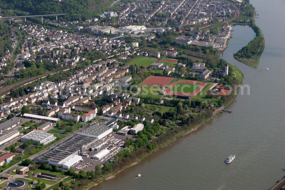 Aerial image Lahnstein - View of the Niederlahnstein part in Koblenz in the state of Rhineland-Palatinate. The city parts - like Niederlahnstein - are located on the right riverbank and partly wooded or surrounded by forest, hills and nature. Niederlahnstein owns large sports facilities and is home to the factory halls and plant of the Roechling-Sustaplast-Group, the production site of technical plastic. The background shows the connection of the rivers Lahn and Rhine