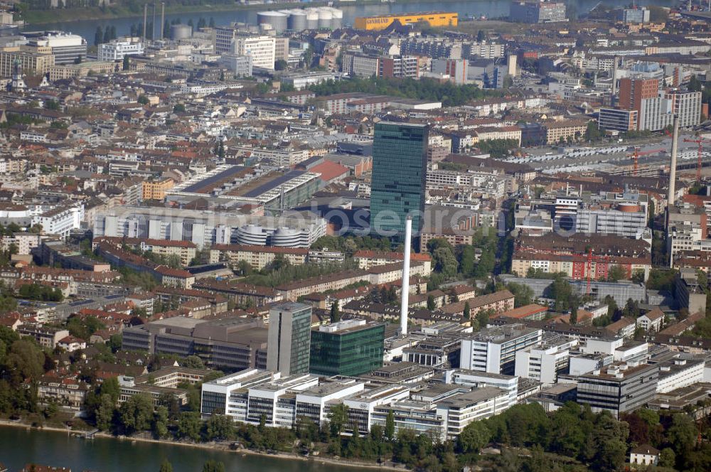 Aerial image Basel - Stadtansicht Basel. Im Vordergrund Die Firma Hoffmann La Roche, Kontakt Medienstelle: Grenzacherstrasse 124, CH-4070 Basel, Tel. +41 (0)61 688 8888, Fax +41 (0)61 691 9391, E-Mail: basel.mediaoffice@roche.com. Im Hintergrund das Messegelände Basel mit Messeturm, Kontakt: MCH Messe Schweiz (Basel) AG, CH-4005 Basel, Tel. +41 (0)58 200 2020, Fax +41 (0)58 206 2194, info@messe.ch