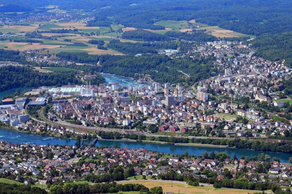 Flurlingen from above - City view on the river bank of the Rhine river in Flurlingen in the canton Zurich, Switzerland, and Neuhausen am Rheinfall in the canton Schaffhausen