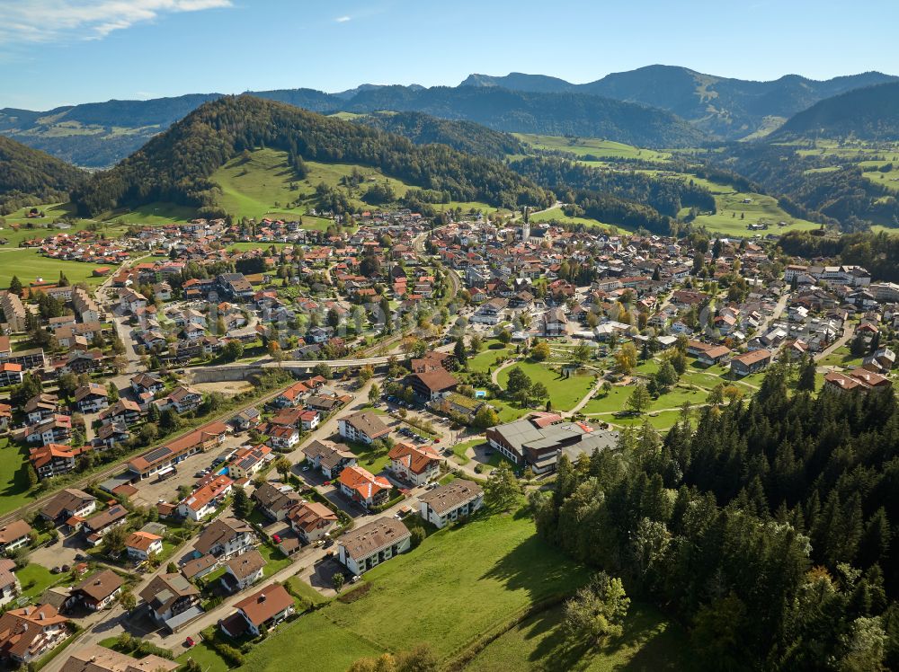 Oberstaufen from above - City view of the inner city area in the valley surrounded by mountains in Oberstaufen Allgaeu in the state Bavaria, Germany