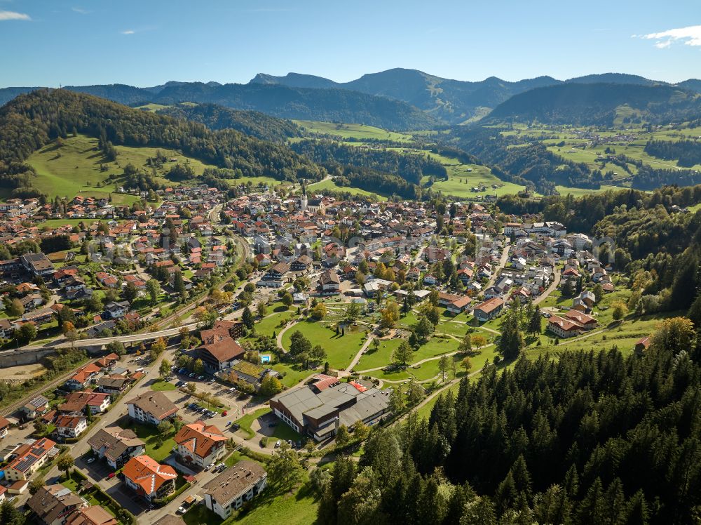 Oberstaufen from above - City view of the inner city area in the valley surrounded by mountains in Oberstaufen Allgaeu in the state Bavaria, Germany