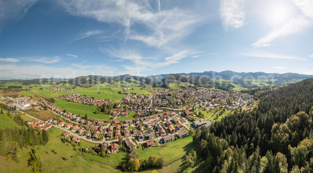 Oberstaufen from above - City view of the inner city area in the valley surrounded by mountains in Oberstaufen Allgaeu in the state Bavaria, Germany