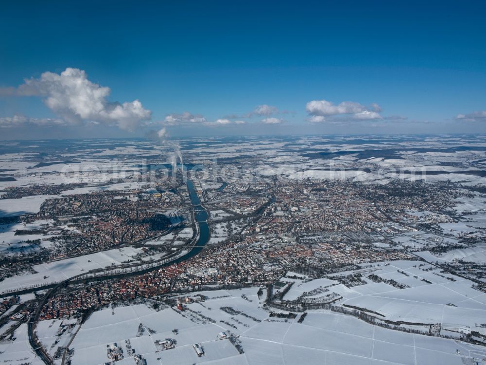 Aerial photograph Heilbronn - HEILBRONN 12/20/2011 Cityview of winter snow covered city area of Heilbronn in Baden-Württemberg. In the suburbs, the coal power plant in Heilbronn in Baden-Württemberg. The cogeneration plant Heilbronn has the largest coal-fired unit at EnBW Kraftwerke AG