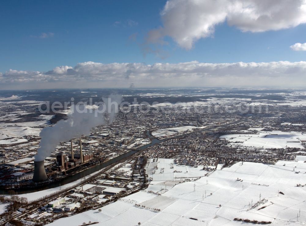 Heilbronn from above - HEILBRONN 12/20/2011 Cityview of winter snow covered city area of Heilbronn in Baden-Württemberg. In the suburbs, the coal power plant in Heilbronn in Baden-Württemberg. The cogeneration plant Heilbronn has the largest coal-fired unit at EnBW Kraftwerke AG