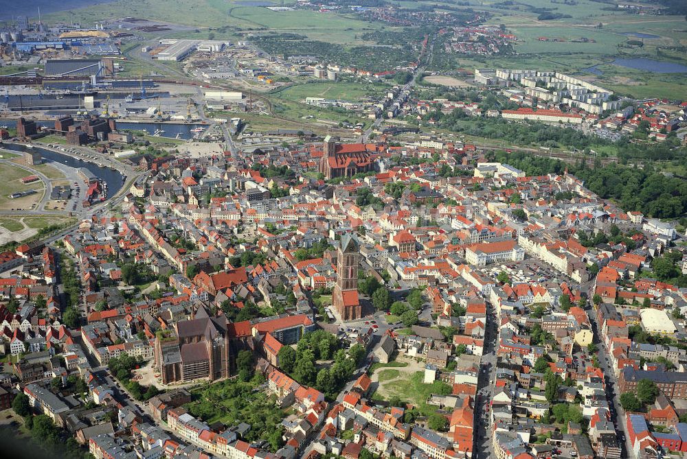 Aerial image Wismar - Blick auf die historische Altstadt von Wismar mit den drei gotischen Backsteinkirchen St. Marien, St. Nikolai und St. Georgen. Das Emsemble gehört zum Weltkulturerbe der UNESCO. View of the historic old town of Wismar with the three Gothic brick churches of St Mary's, St. Nicholas and St. Georgen. The Emsemble World Heritage by UNESCO.