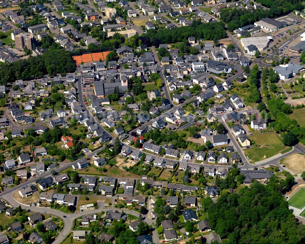 Emmelshausen from the bird's eye view: View of the town centre of Emmelshausen in the state of Rhineland-Palatinate. The town is an official spa resort in the county district of Rhine-Hunsrueck, surrounded by fields, meadows and forest. The East of the town centre includes residential areas