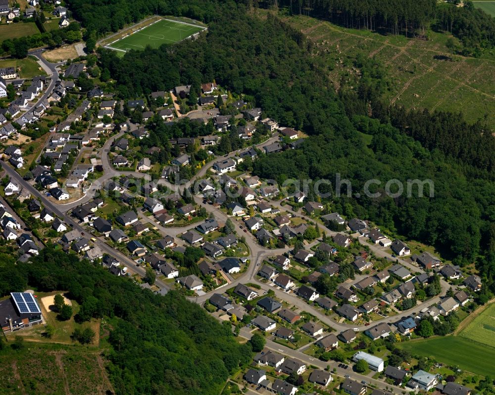 Aerial photograph Emmelshausen - View of the town centre of Emmelshausen in the state of Rhineland-Palatinate. The town is an official spa resort in the county district of Rhine-Hunsrueck, surrounded by fields, meadows and forest. The East of the town centre includes residential areas