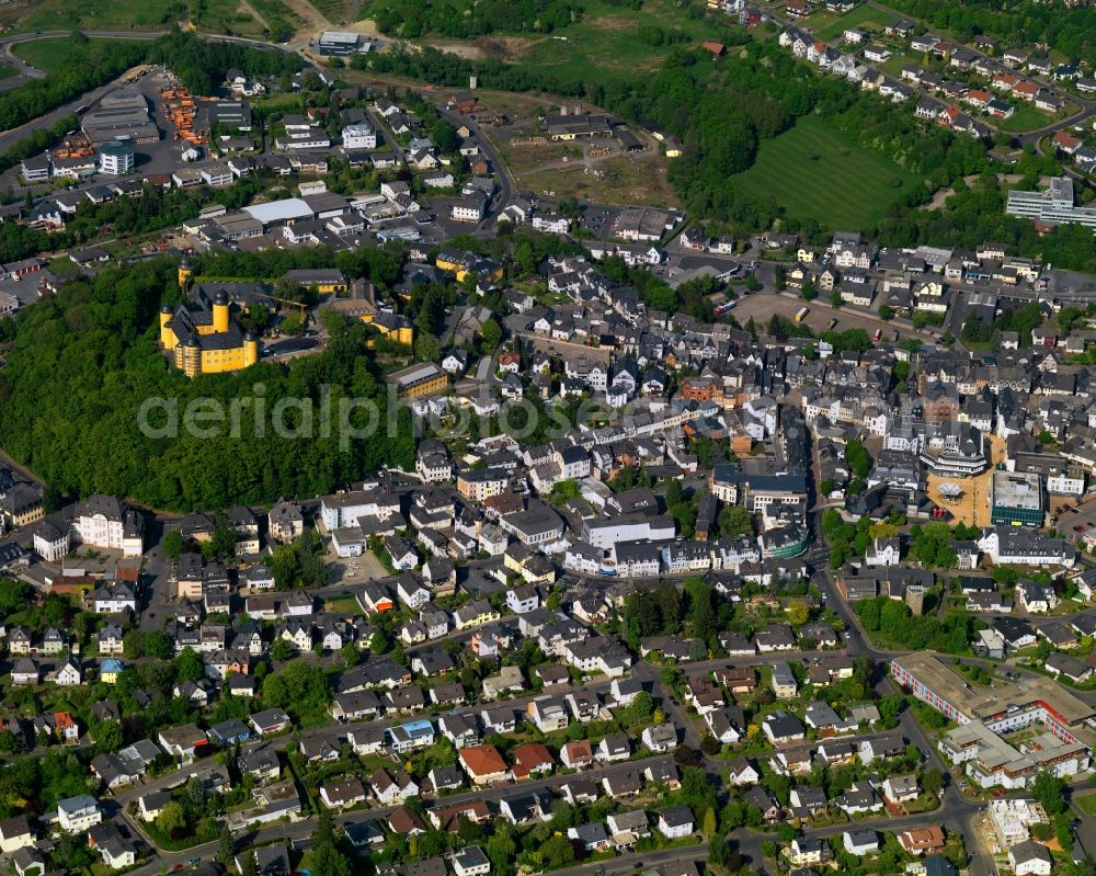 Montabaur from above - View of the town centre of Montabaur in the state Rhineland-Palatinate. The official tourist resort is the seat of administration of the county district of Westerwald. The town is an economic centre of the region and know for its castle and train station. The castle with its yellow facade is located in the town centre, on the castle hill