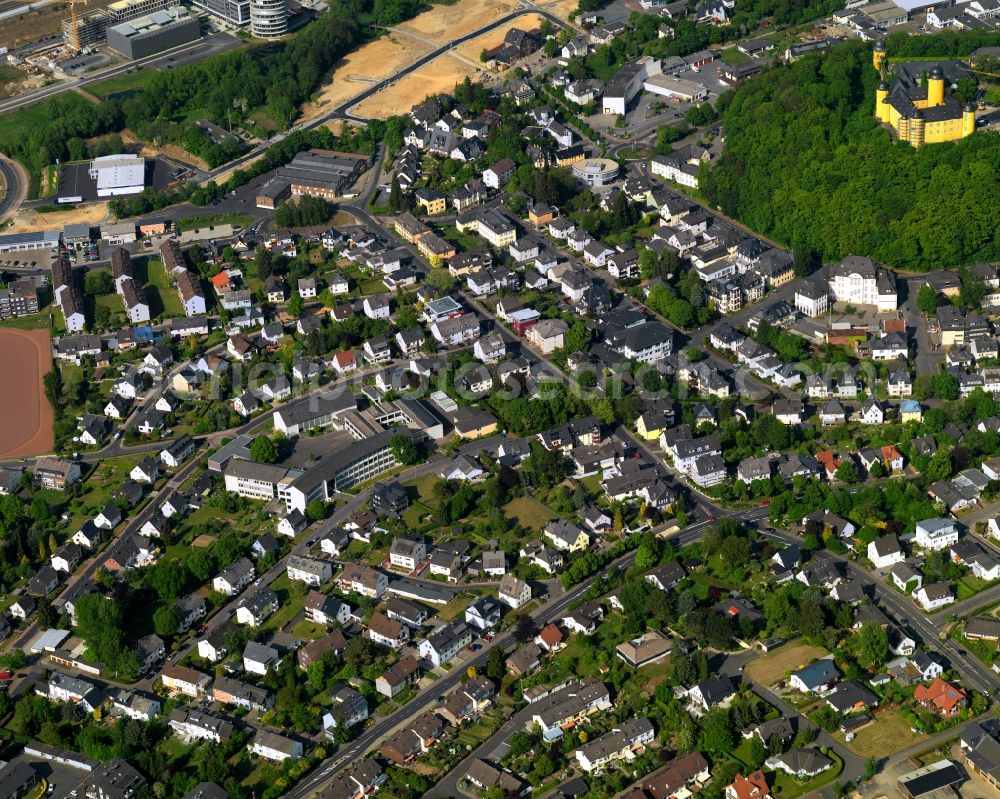 Montabaur from the bird's eye view: View of the town centre of Montabaur in the state Rhineland-Palatinate. The official tourist resort is the seat of administration of the county district of Westerwald. The town is an economic centre of the region and know for its castle and train station. The castle with its yellow facade is located in the town centre, on the castle hill