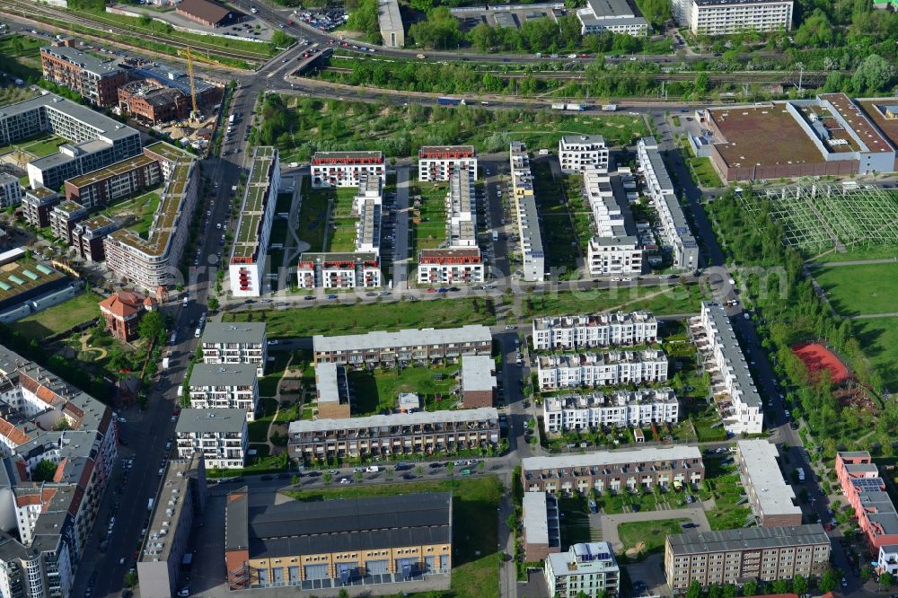 Berlin from above - Urban development area on the premises of Eldenaer road - Storkower Strasse in Friedrichshain district of Berlin. On the grounds of the former East German slaughterhouse incur modern residential areas and neighborhoods. The housing companies in the real estate developers cds Wohnbau Berlin GmbH built on several building plots modern apartments and townhouses and terraced houses