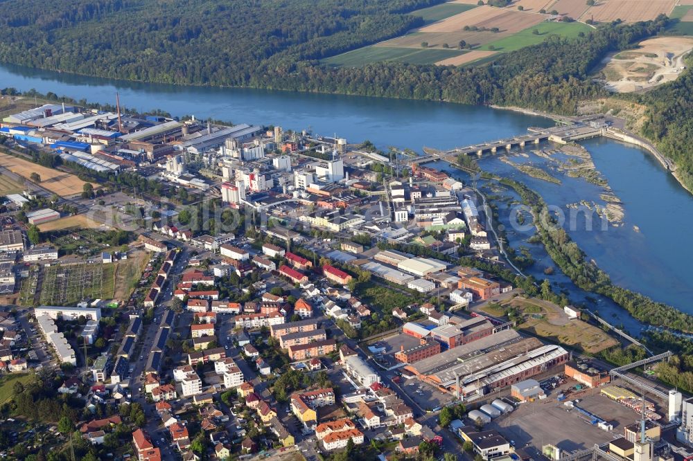 Rheinfelden (Baden) from the bird's eye view: City area with outside districts, industrial areas with Evonik, Rheinfelden Alloys and hydro power plant of Energiedienst at the river Rhine in Rheinfelden (Baden) in the state Baden-Wurttemberg, Germany